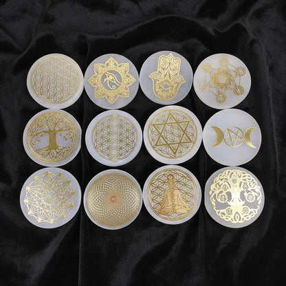Set of gold geometric and symbolic designs on clear circular stamps against a blue textured background.