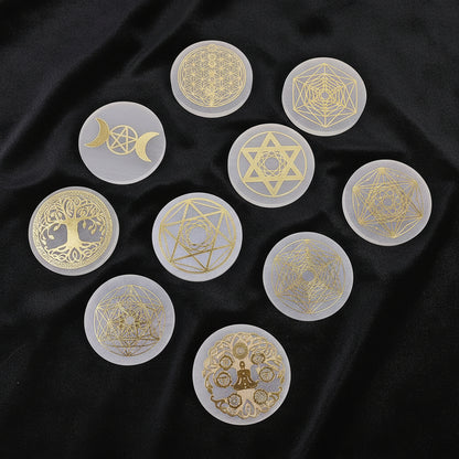 Set of gold and white circular stickers with various symbols on a blue fabric background