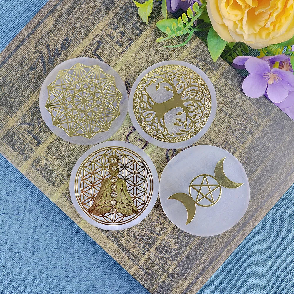 Four gold geometric designs on white circular cards with flowers in the background.