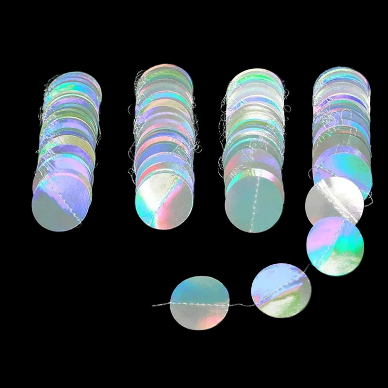 Set of holographic round stickers on a black background