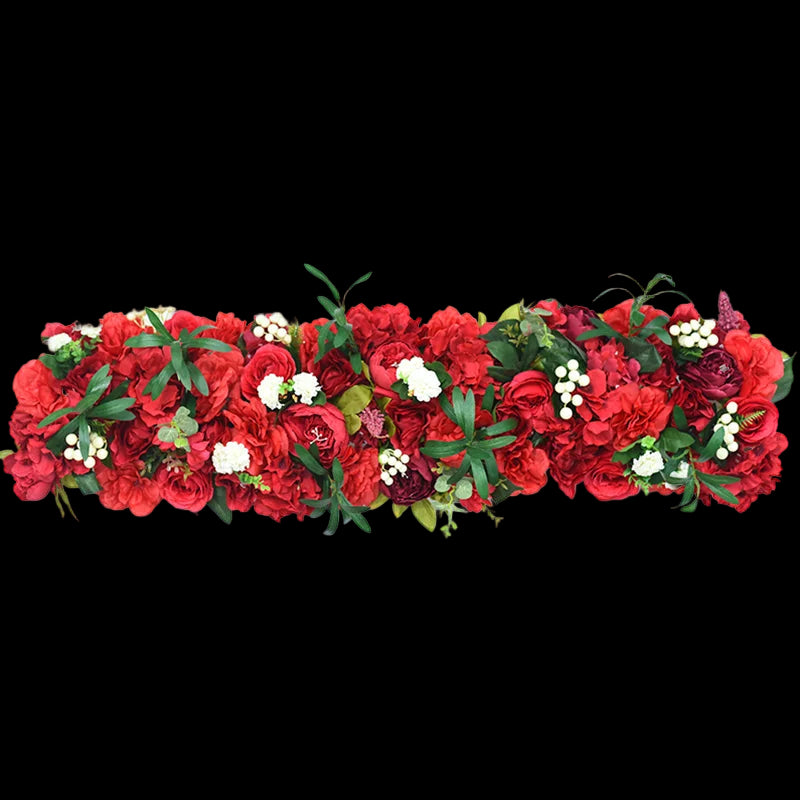 Red floral garland with green leaves on a white background