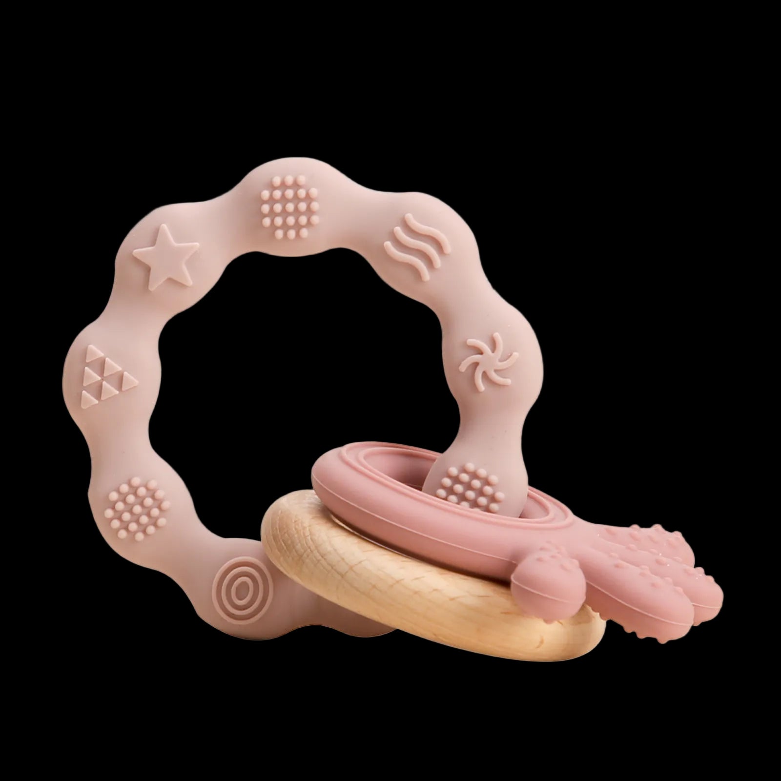 Pink and beige teething ring with textured surface on a white background