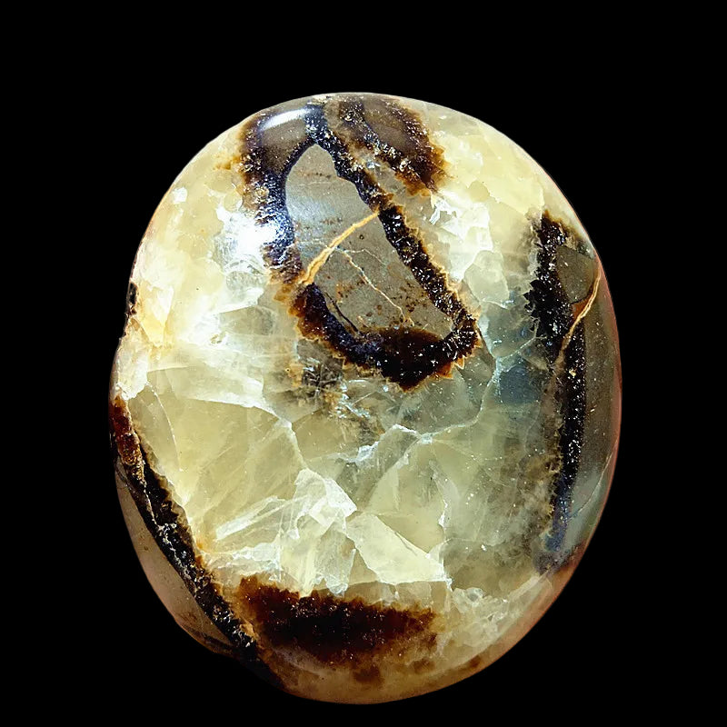 Crystal rock held in a hand with a blurred background