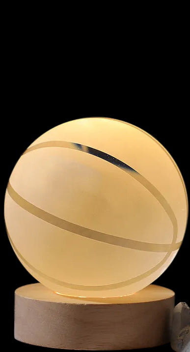 Spherical lamp with wooden base on a dark background