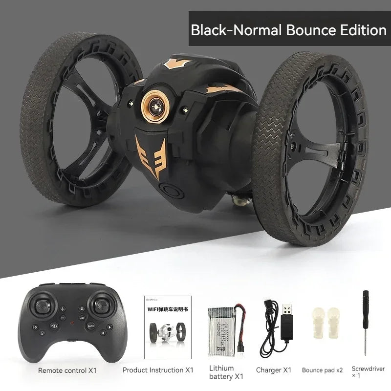Black bouncy vehicle with remote control, battery, and accessories on a gray and white background