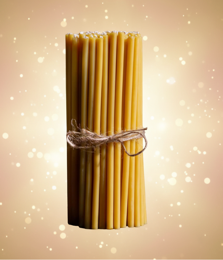 Bundle of uncooked pasta tied with twine on a black background