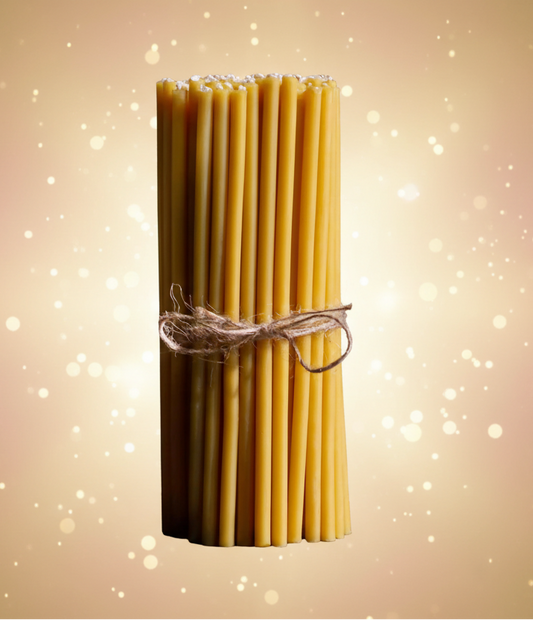 Bundle of uncooked pasta tied with twine on a black background
