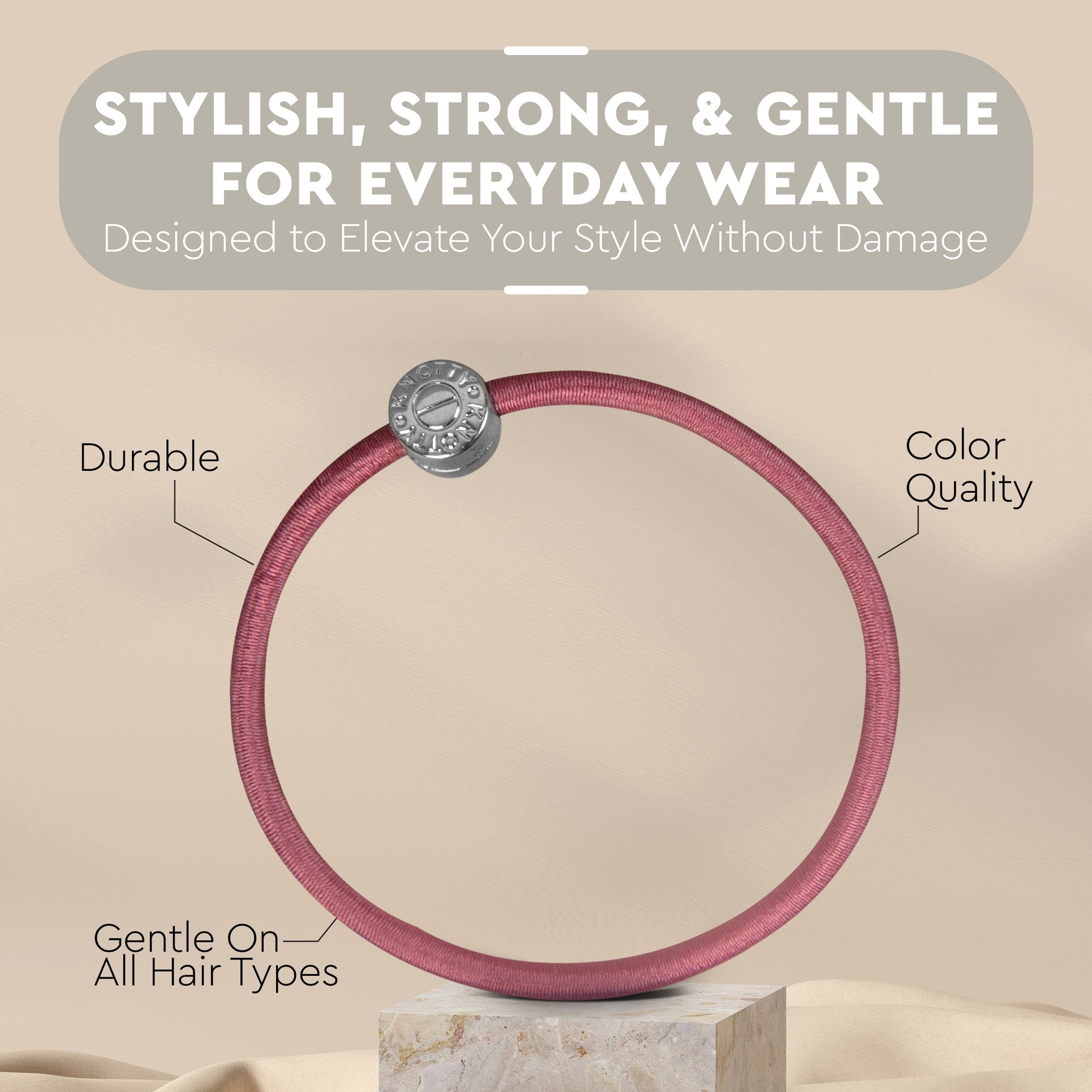 Pink hair tie with text highlighting its features on a beige background