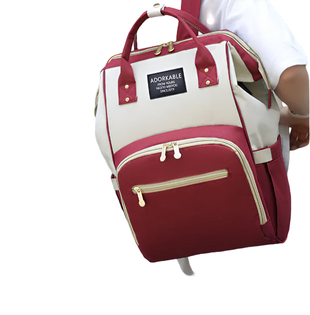 Person wearing a red and beige backpack with 'Adorkable' branding.