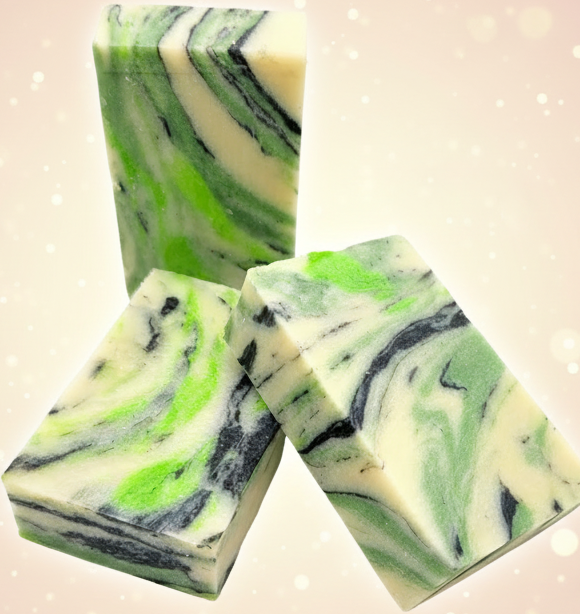Three bars of soap with green and black swirls on a textured gray background.