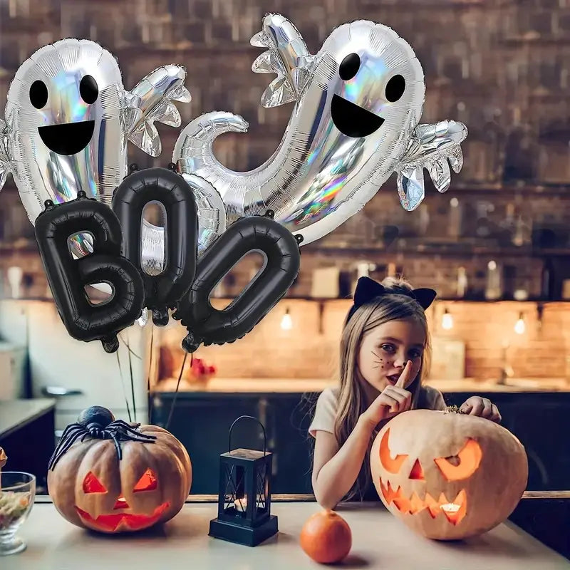 Halloween-themed balloons with 'BOO' and ghost shapes, a child with a carved pumpkin, and a candle in a kitchen.