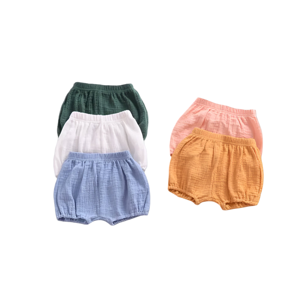 Five colorful baby bloomers on a light gray background