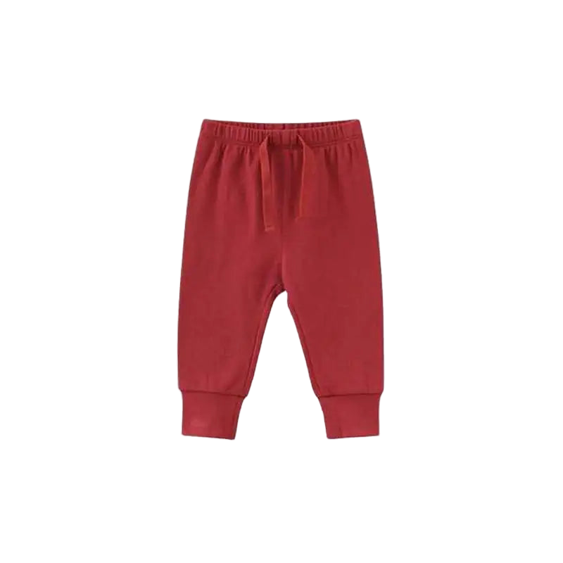 Red baby pants on a white background