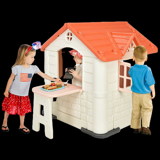 Children playing around a toy playhouse with a red roof.