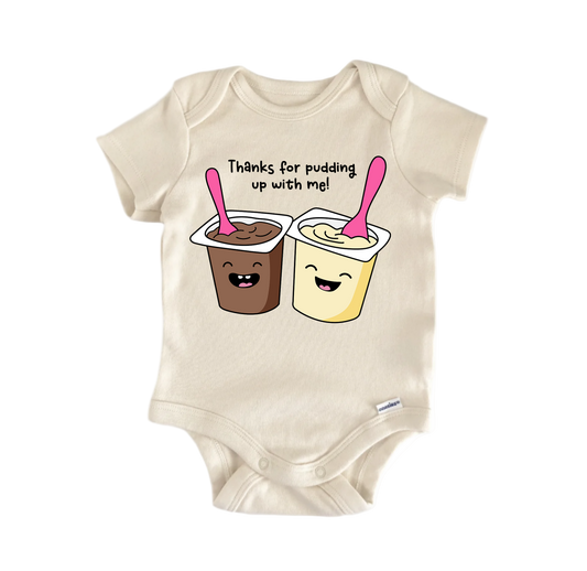 Beige baby onesie with cartoon pudding cups and text on a white background