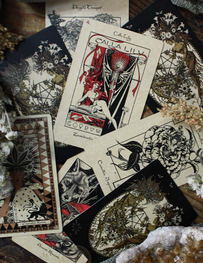 Collection of tarot cards with intricate designs on a textured surface.