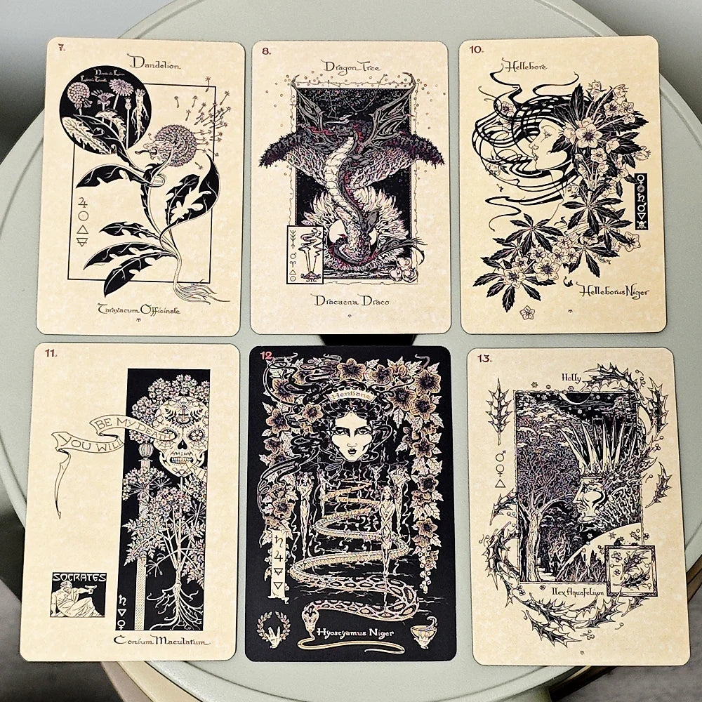 Set of six tarot cards with intricate designs on a gray background