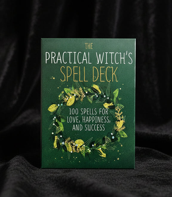 Book titled 'The Practical Witch's Spell Deck' with green cover and decorative text.