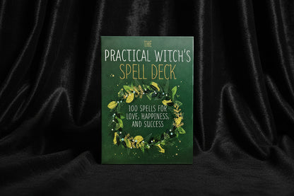 Book titled 'The Practical Witch's Spell Deck' with green cover and decorative text.