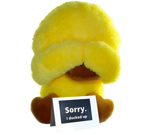Yellow plush toy with a card saying 'Sorry. I ducked up' on a white background