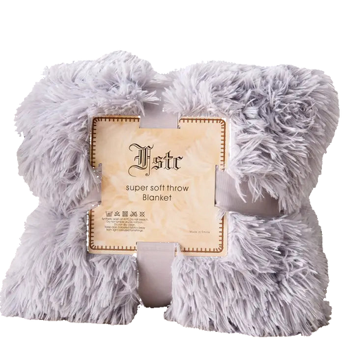 Fluffy gray throw blanket with a brand label on a light background