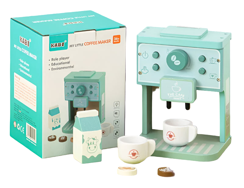 Children's simulated coffee machine with packaging on a green surface