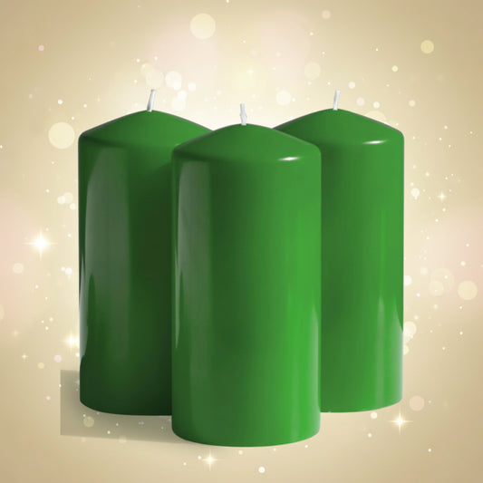 Three green candles on a white background