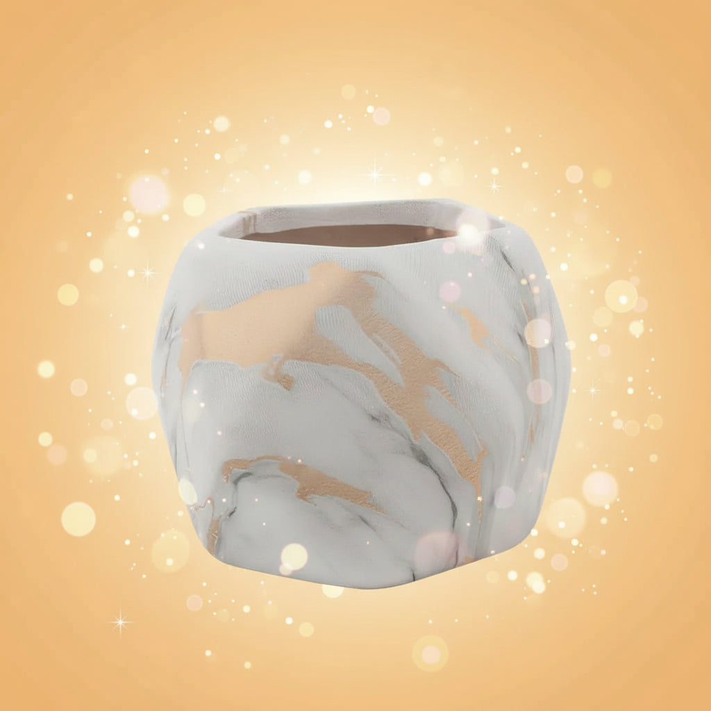 Marble-patterned pot with gold accents on a white background