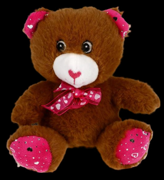 Brown teddy bear with pink accents on a white background