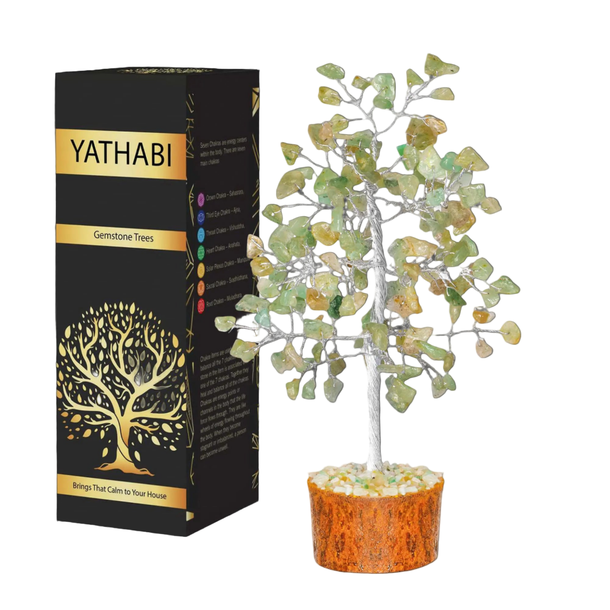 Yathabi gemstone tree next to its packaging on a white background