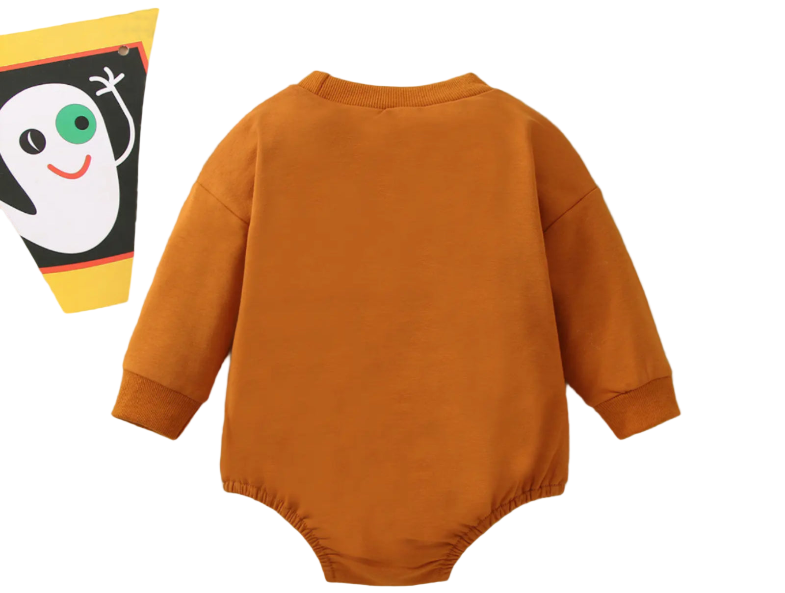 Brown baby onesie on a beige background with Halloween-themed decorations.