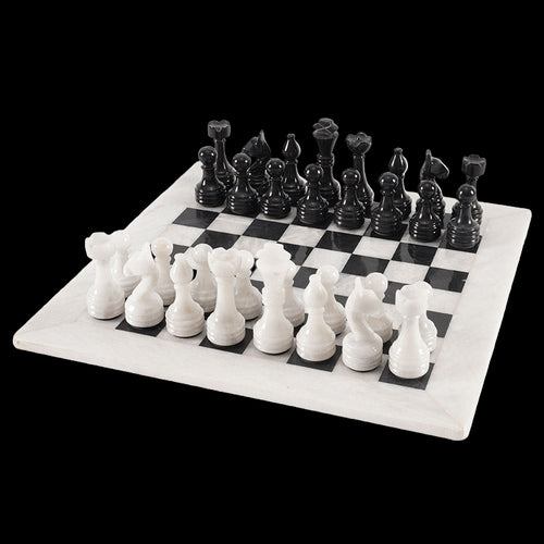 Black and white chess pieces on a checkered board