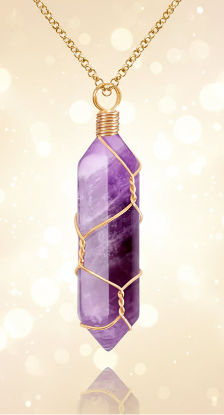 Purple crystal pendant with gold wire wrapping on a white background