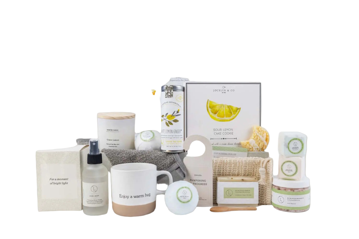 Collection of home care products including a mug, candles, and boxes on a white background