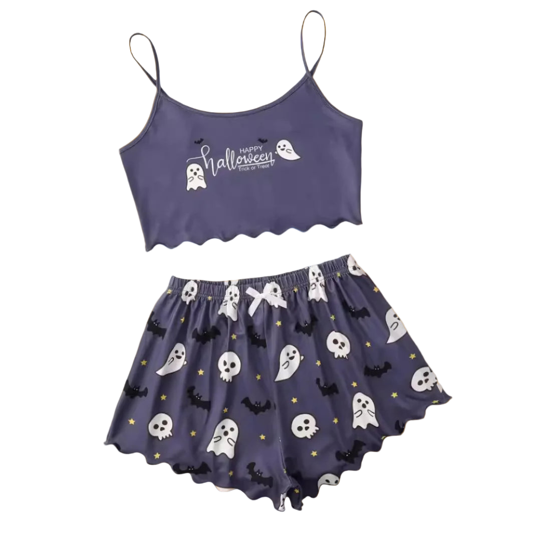 Halloween-themed purple crop top and skirt set on a white background with decorative items.