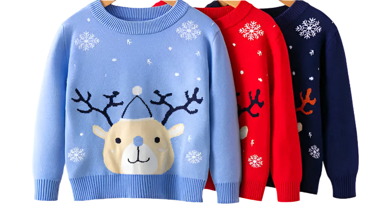 Three children's sweaters in blue, red, and navy with reindeer designs on hangers against a white background.