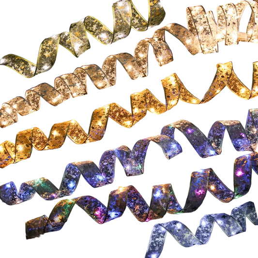 Decorative ribbon lights in gold, silver, and purple on a black background