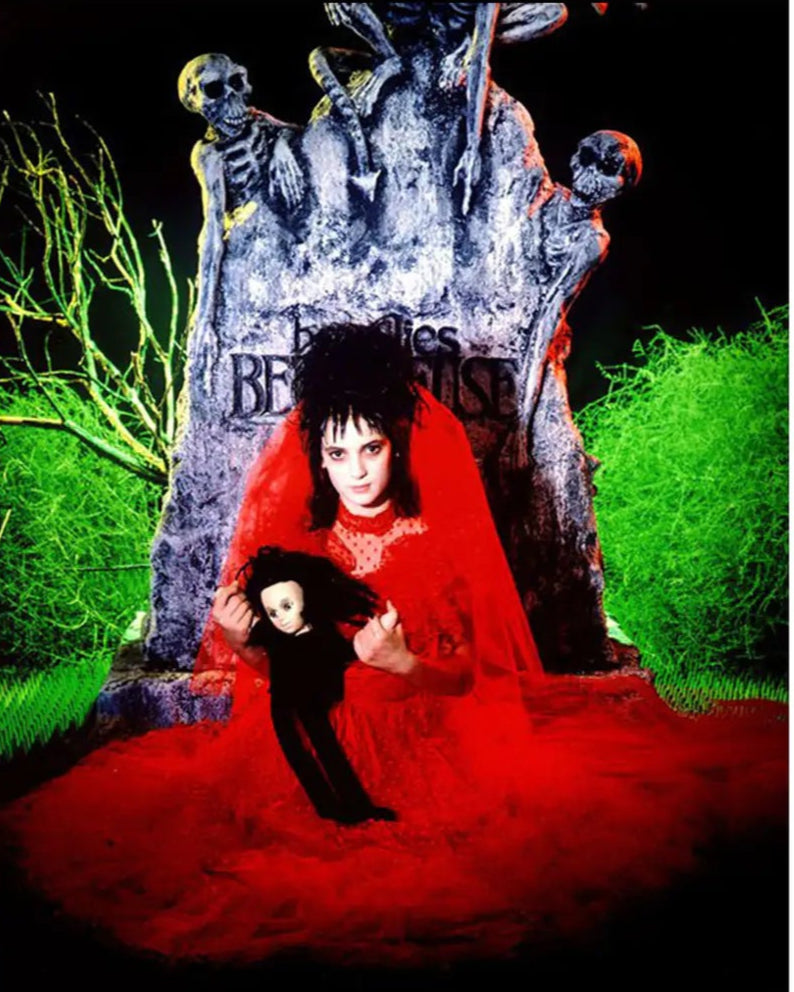 Red gothic-style dress with a veil on a mannequin against a white background