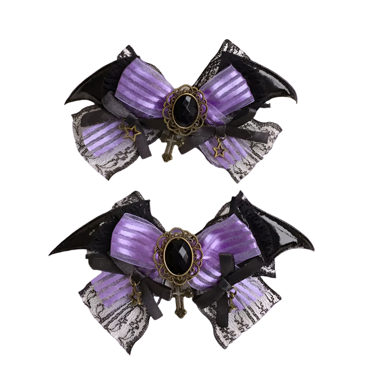 Pair of purple and black decorative bows with lace details on a white background