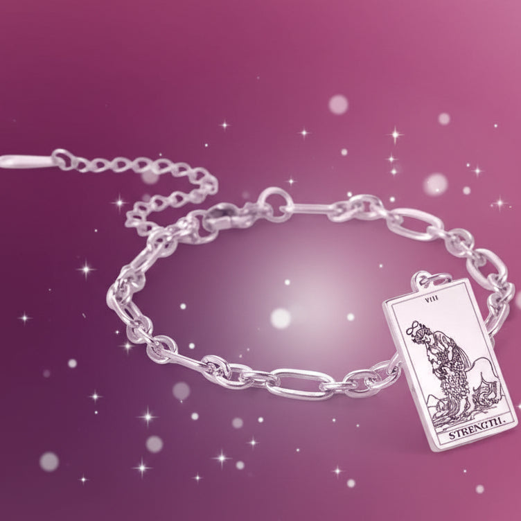 Silver bracelet with a tarot card charm on a white background