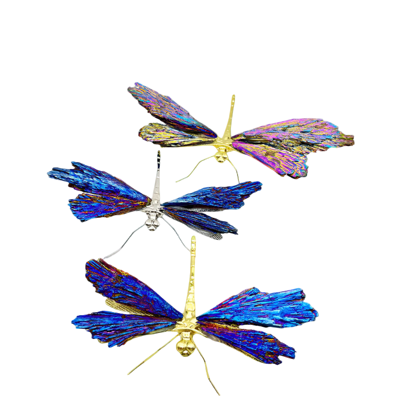 Three butterfly-shaped decorative items with iridescent wings on a white background