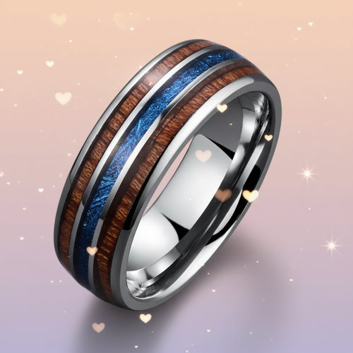 Silver ring with wooden and blue inlay on a gray background