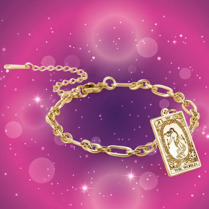Gold bracelet with tarot card charm on a white background