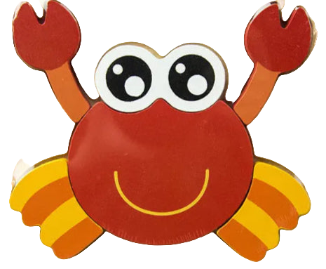 Wooden block with a red crab design on a wooden surface with books in the background