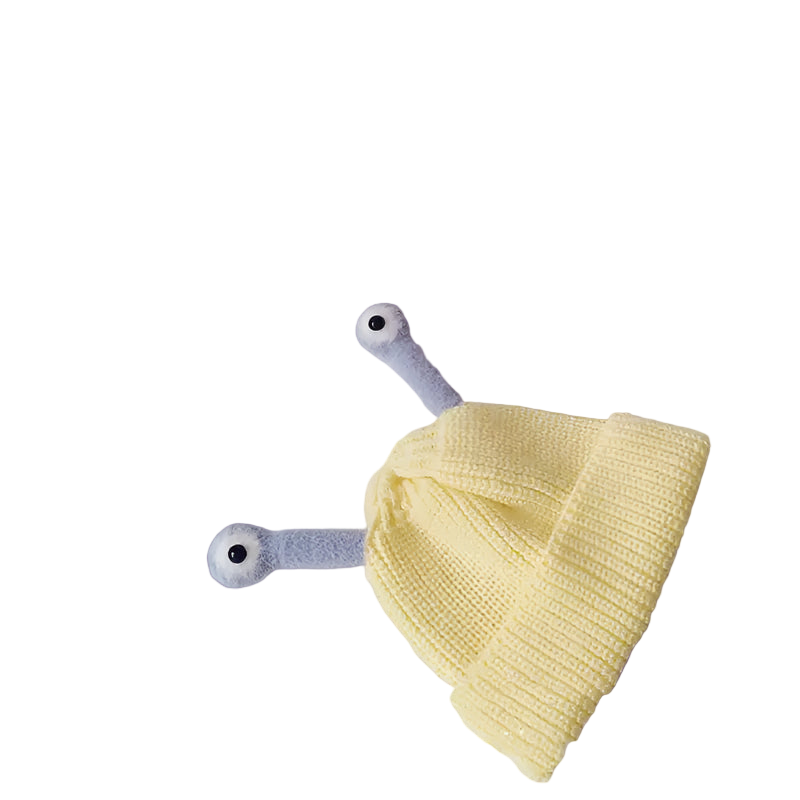 Yellow knitted baby hat with blue and gray accents on a light gray background