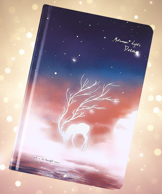Notebook with a tree design on a dark background with confetti