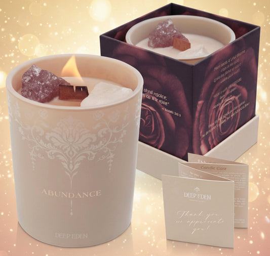 Candle with decorative packaging and card on a white background