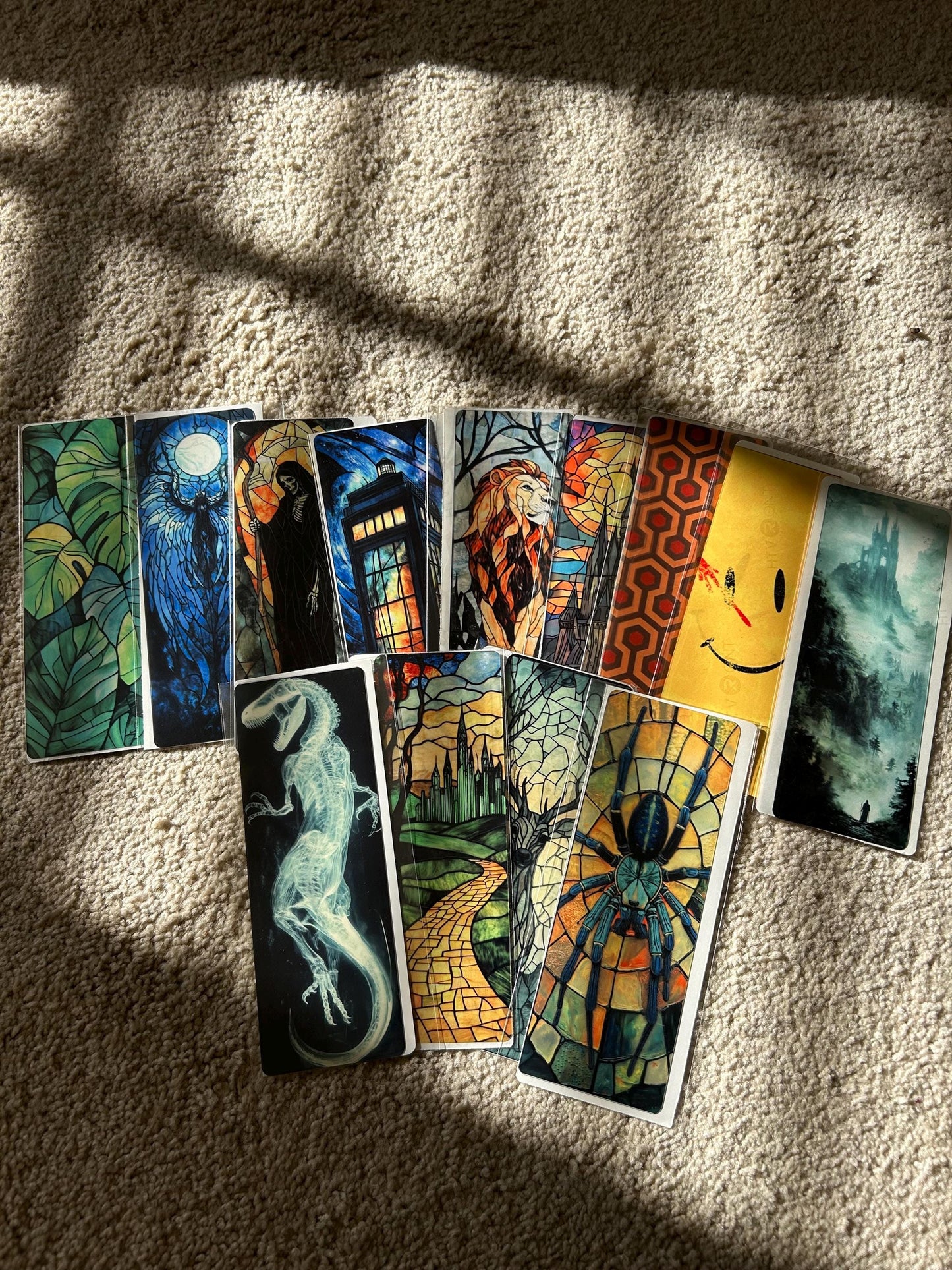 Collection of colorful tarot cards on a textured surface