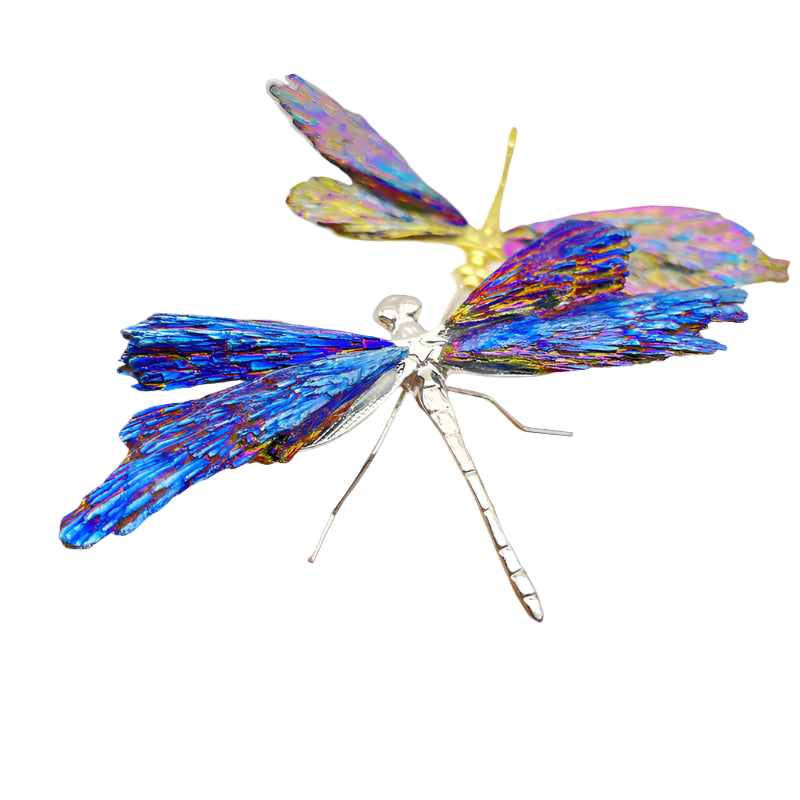 Colorful dragonfly-shaped hair clip on a hand against a white background