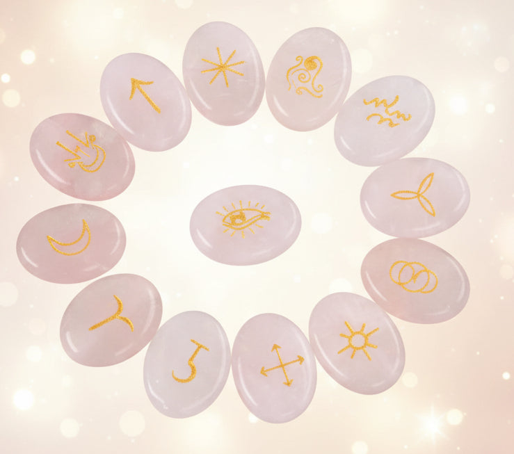 Set of crystal stones with engraved symbols arranged in a circle on a black background